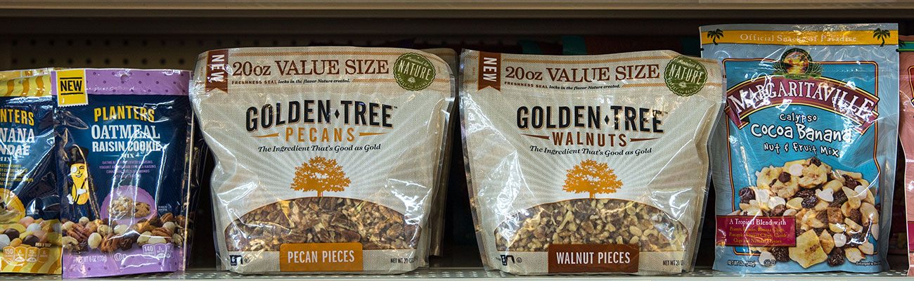 Golden Tree pecans and walnuts bags on a grocery shelf