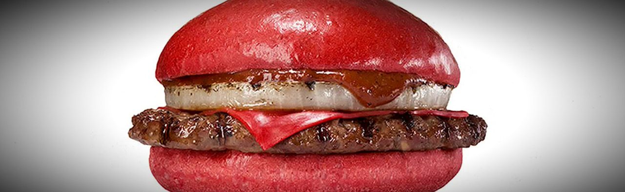 Burger King red-bun burger with cheese and sauce