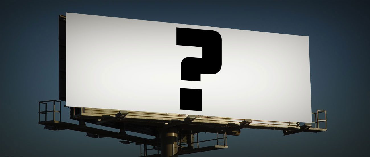 Blank billboard with a large question mark against a night sky