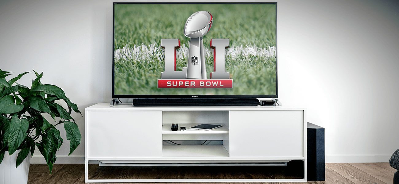 Television on a white console showing the Super Bowl LI logo