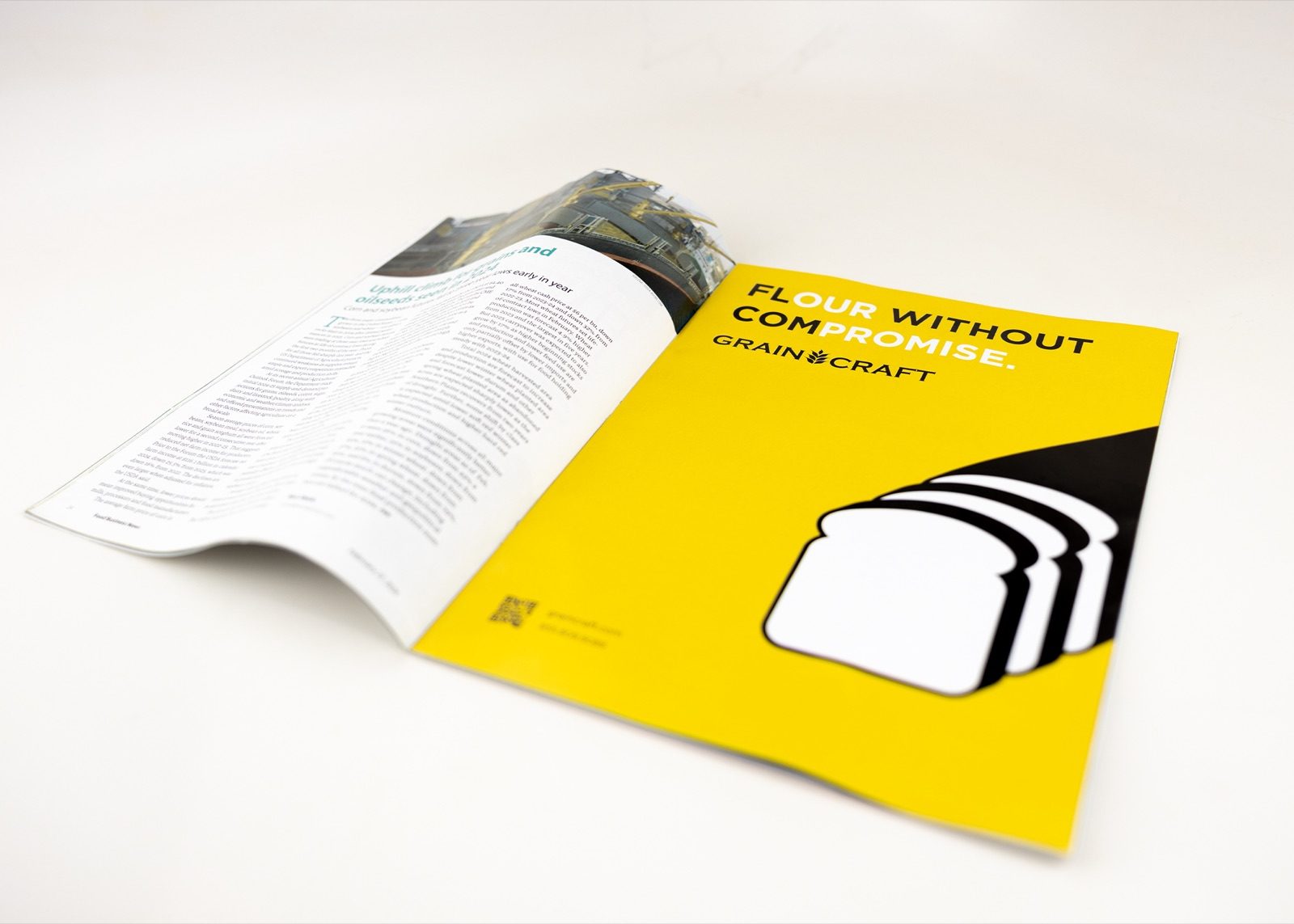 A magazine open to a yellow Grain Craft advert reading 'Flour Without Compromise'