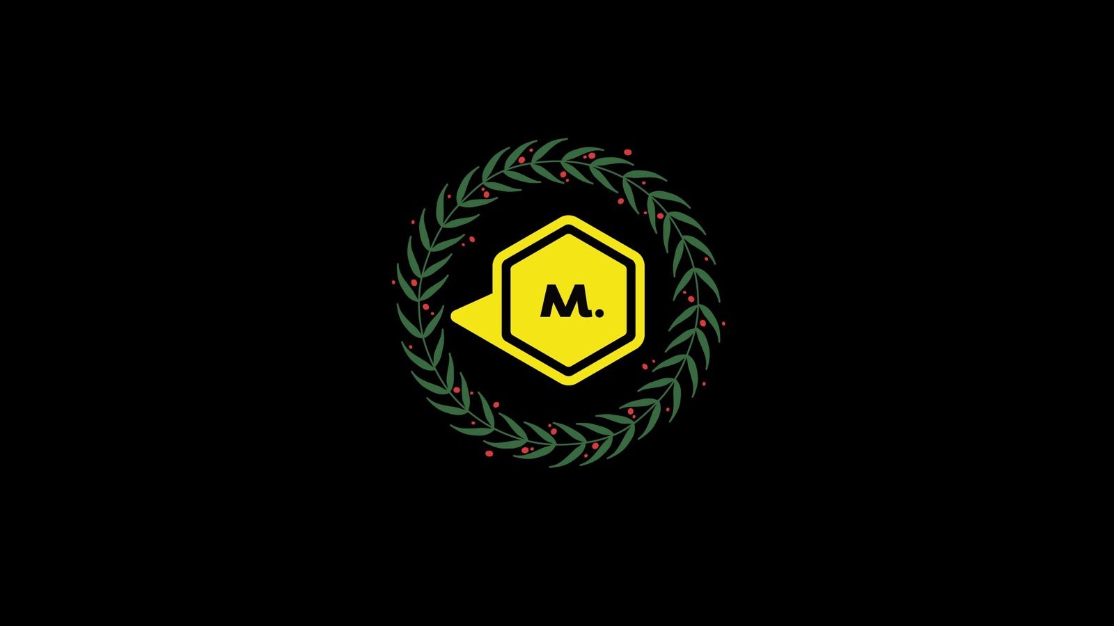 The Maycreate M mark inside a green wreath on a black background