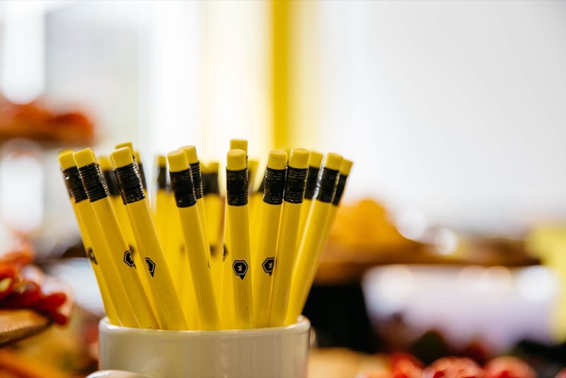 Cup of yellow Maycreate pencils