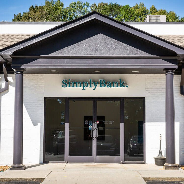 Simply Bank branch entrance with columns and the new sign