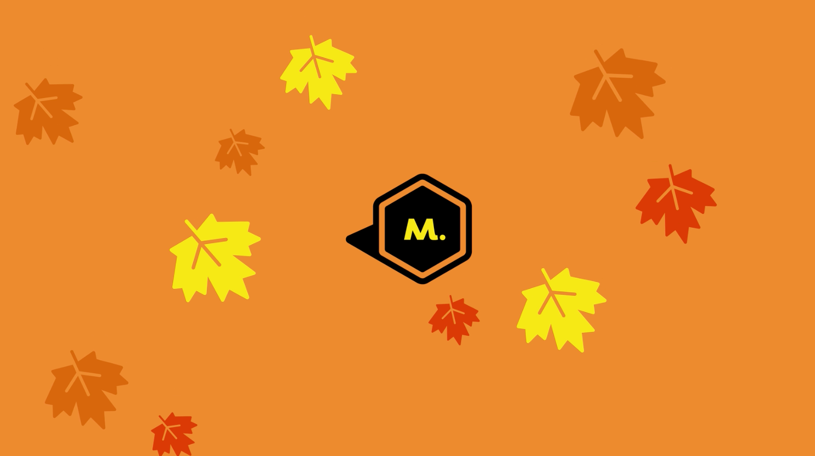 The Maycreate M mark on an orange background scattered with autumn leaves
