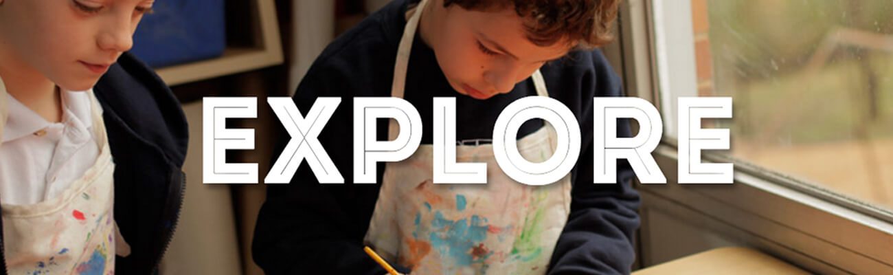 Two children painting beneath the word Explore