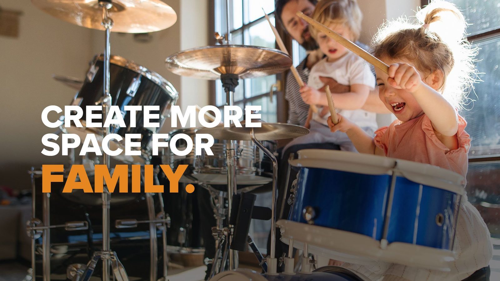 Two children playing a drum kit, captioned 'Create more space for family'