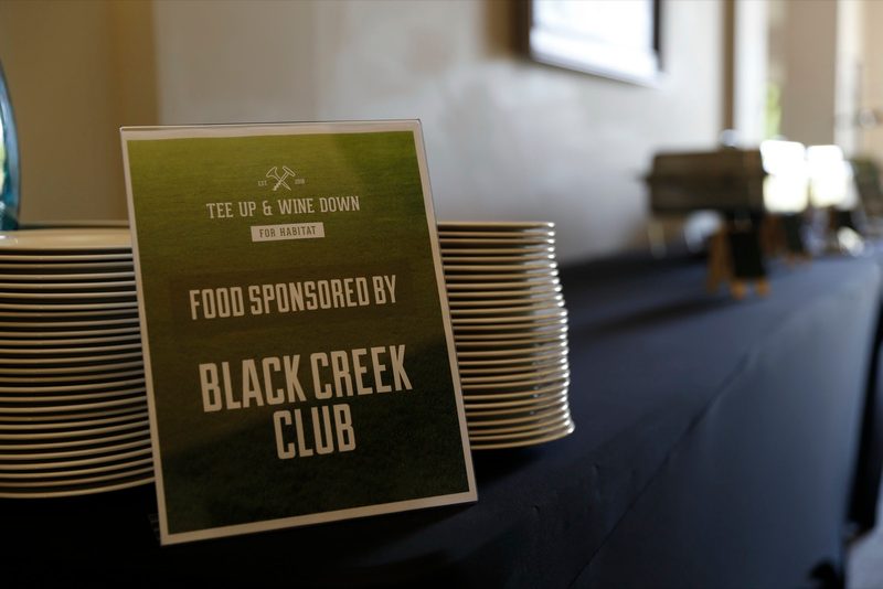 Sign at a buffet reading Food Sponsored by Black Creek Club