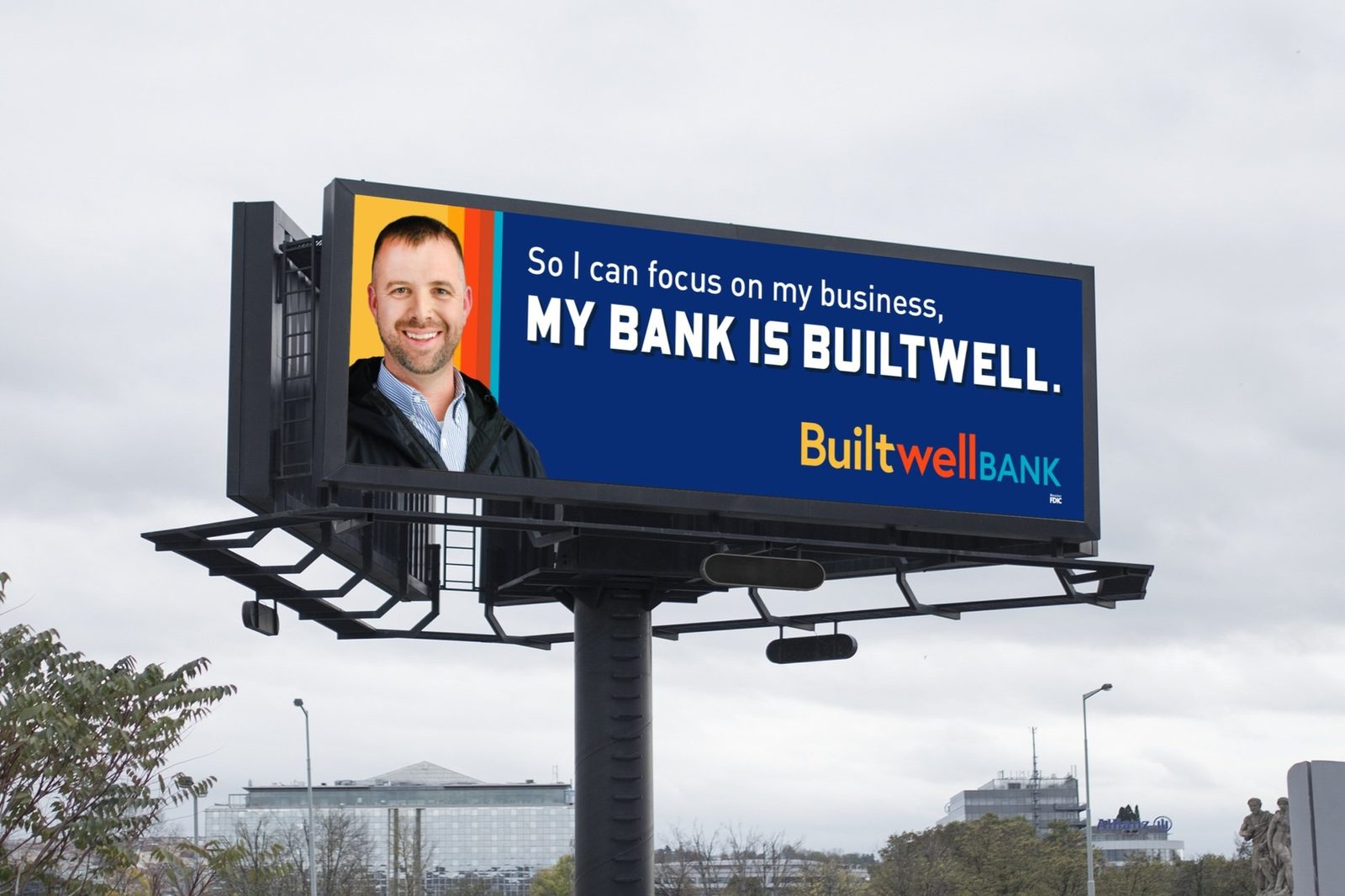 Builtwell Bank billboard with a smiling man: So I can focus on my business, my bank is Builtwell
