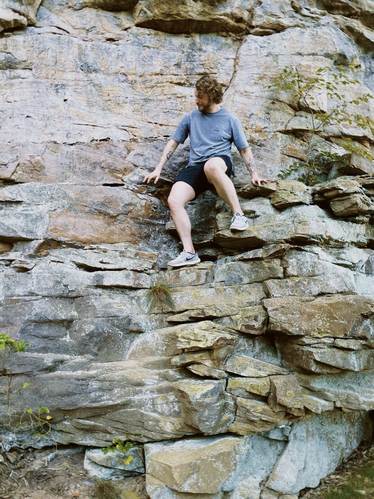Daniel climbing a rock face