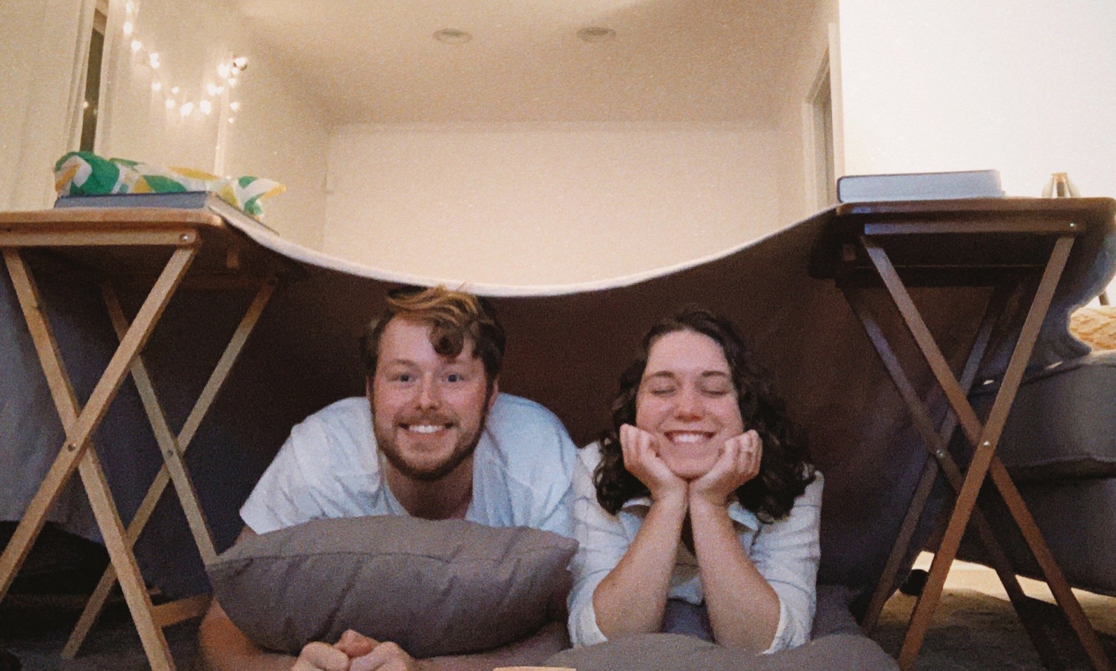 Daniel and Trisha under a blanket fort
