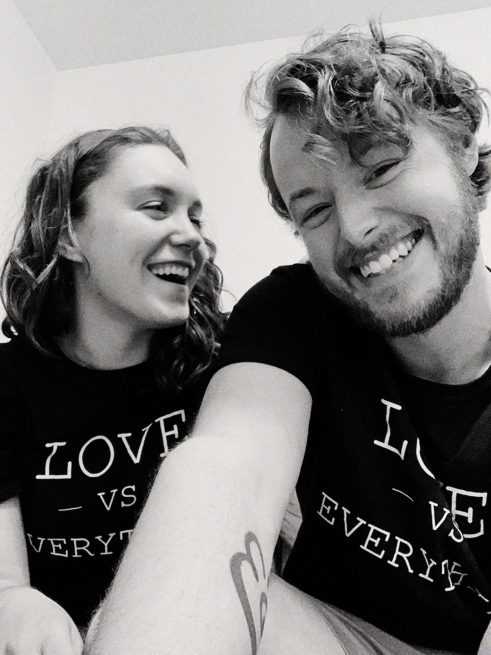 Daniel and Trisha in matching Love vs Everything shirts