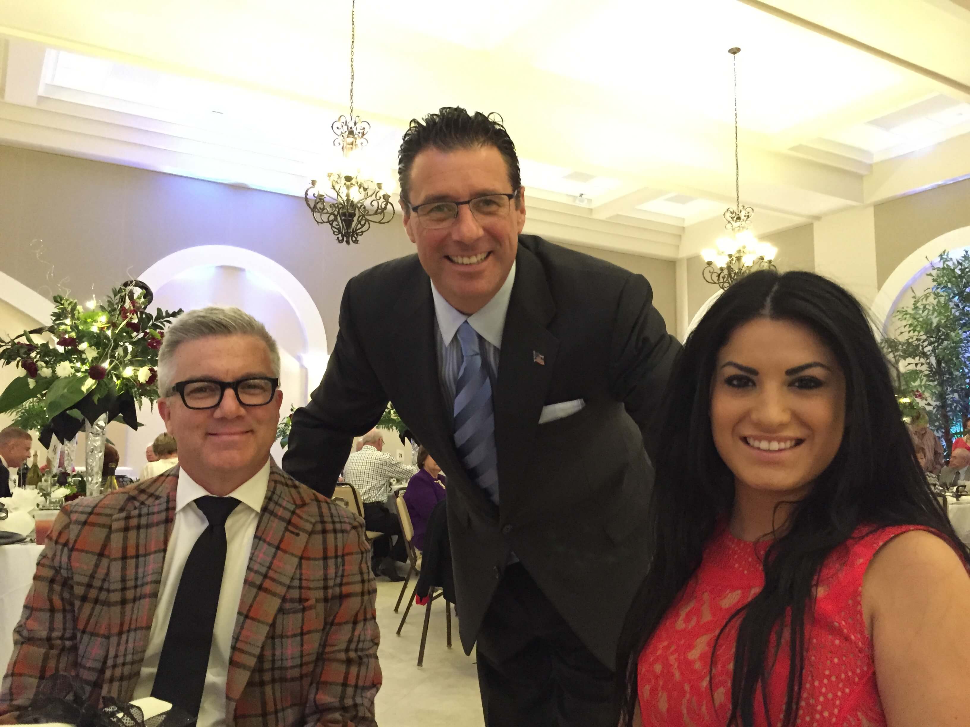 Eric with friends at a banquet
