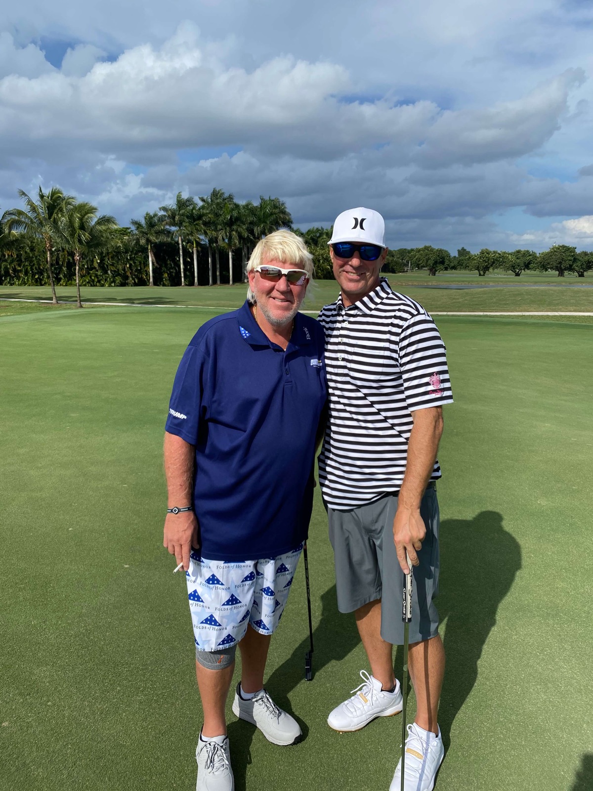 Eric with John Daly on the green