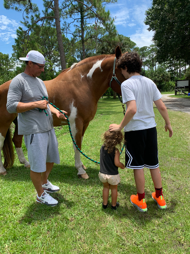 Eric and the kids meeting a horse