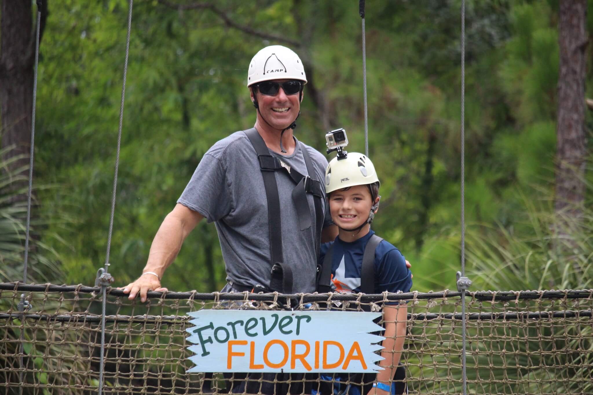 Eric and his son on a zipline course in Florida
