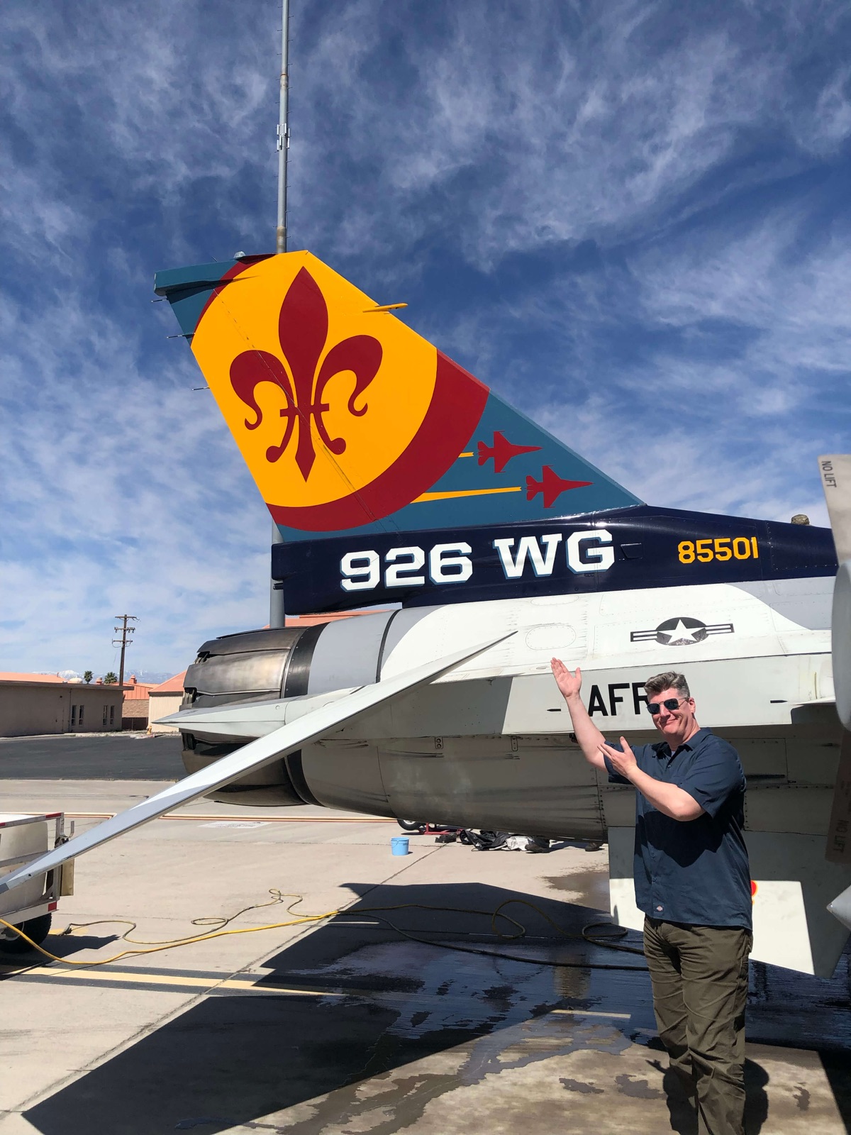 Grant beside an F-16 on the flight line