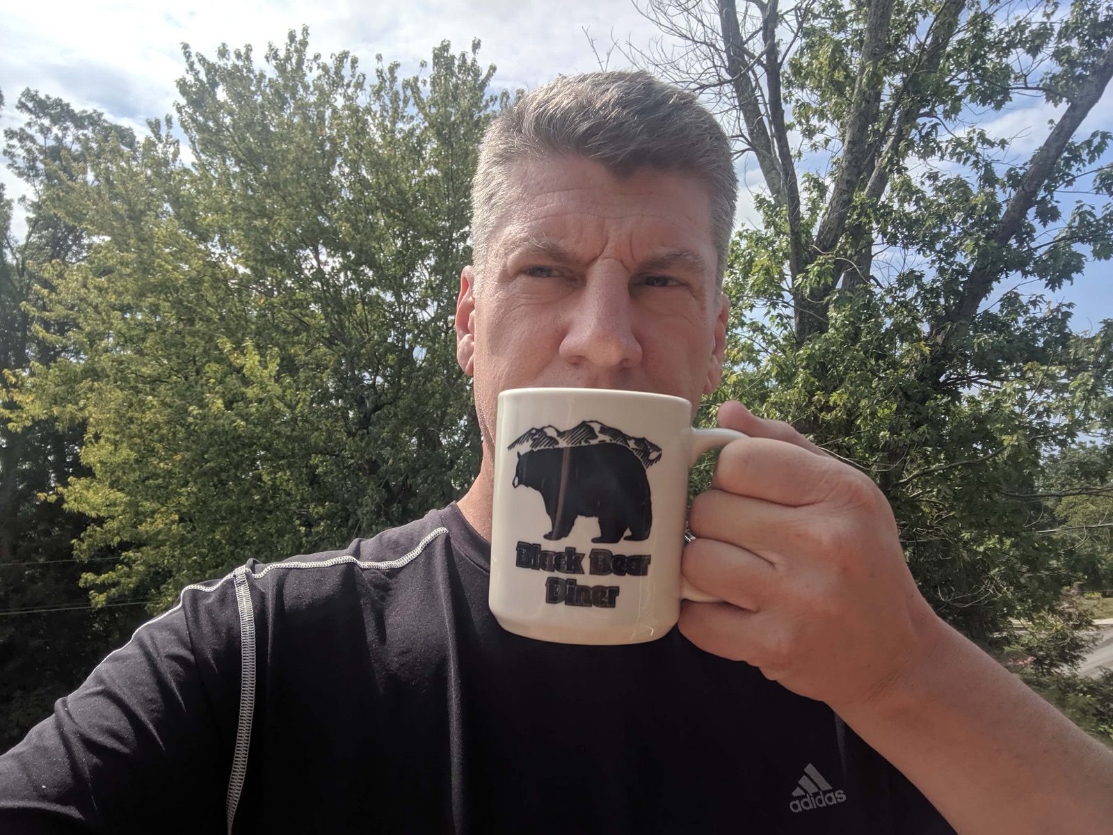 Grant with a Black Bear Diner mug