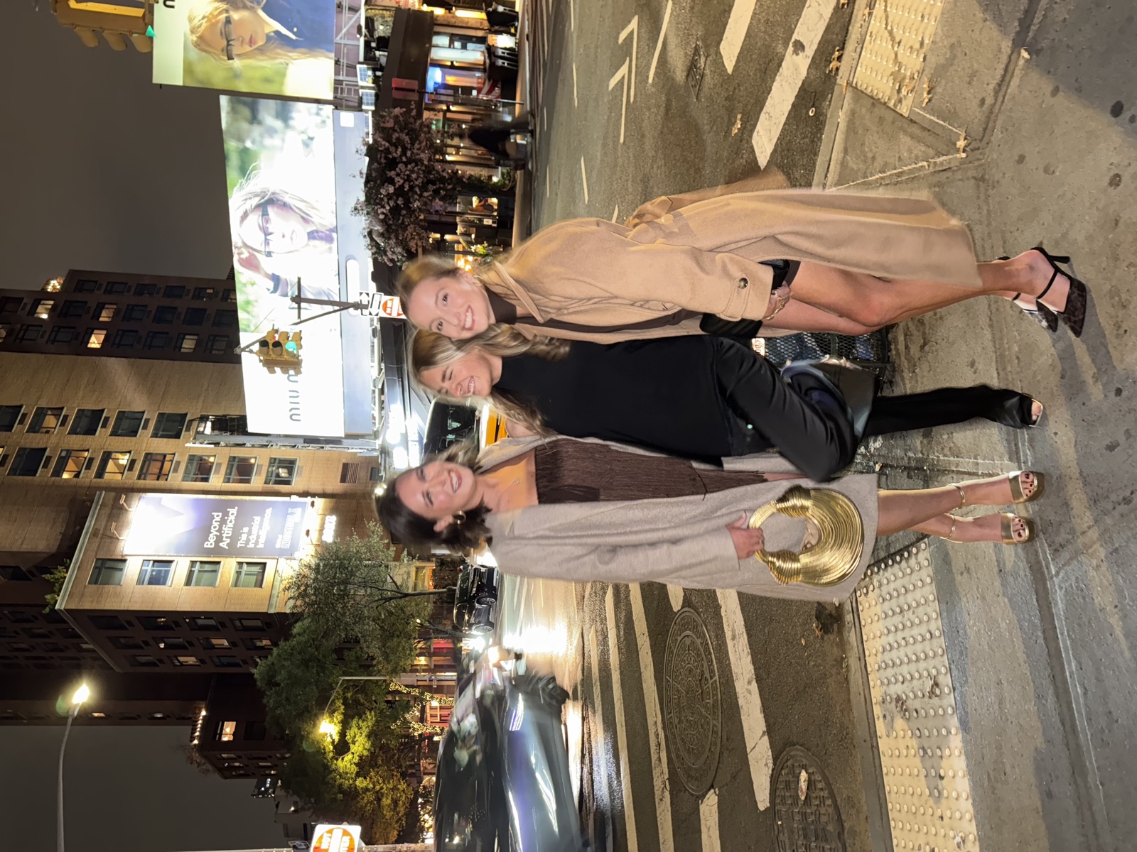Lilee and friends on a New York crosswalk at night