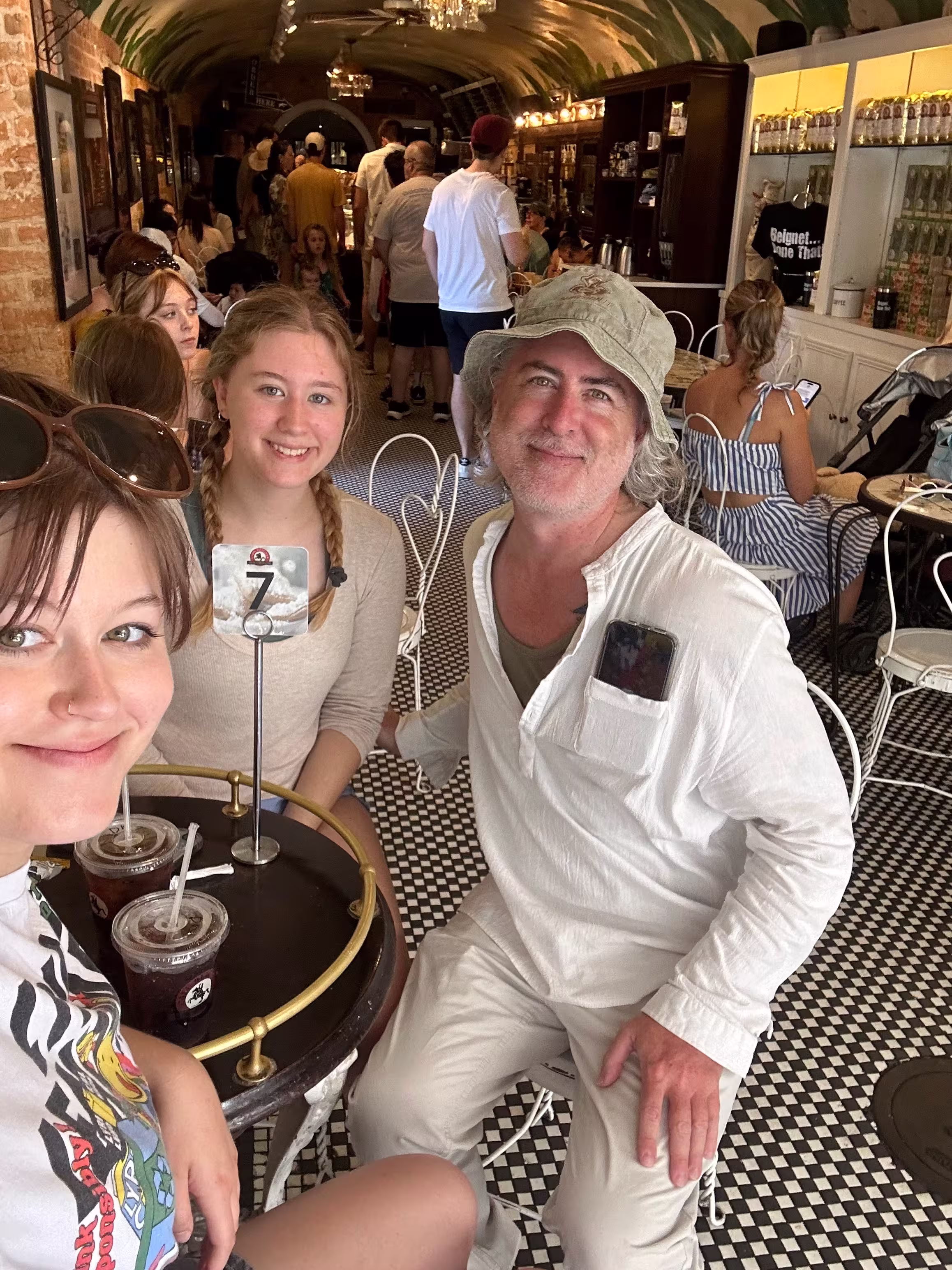 Lizzy with family over beignets in New Orleans