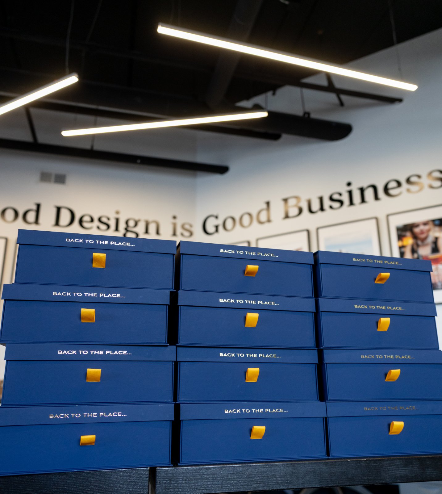 Stacked invitation boxes at the studio