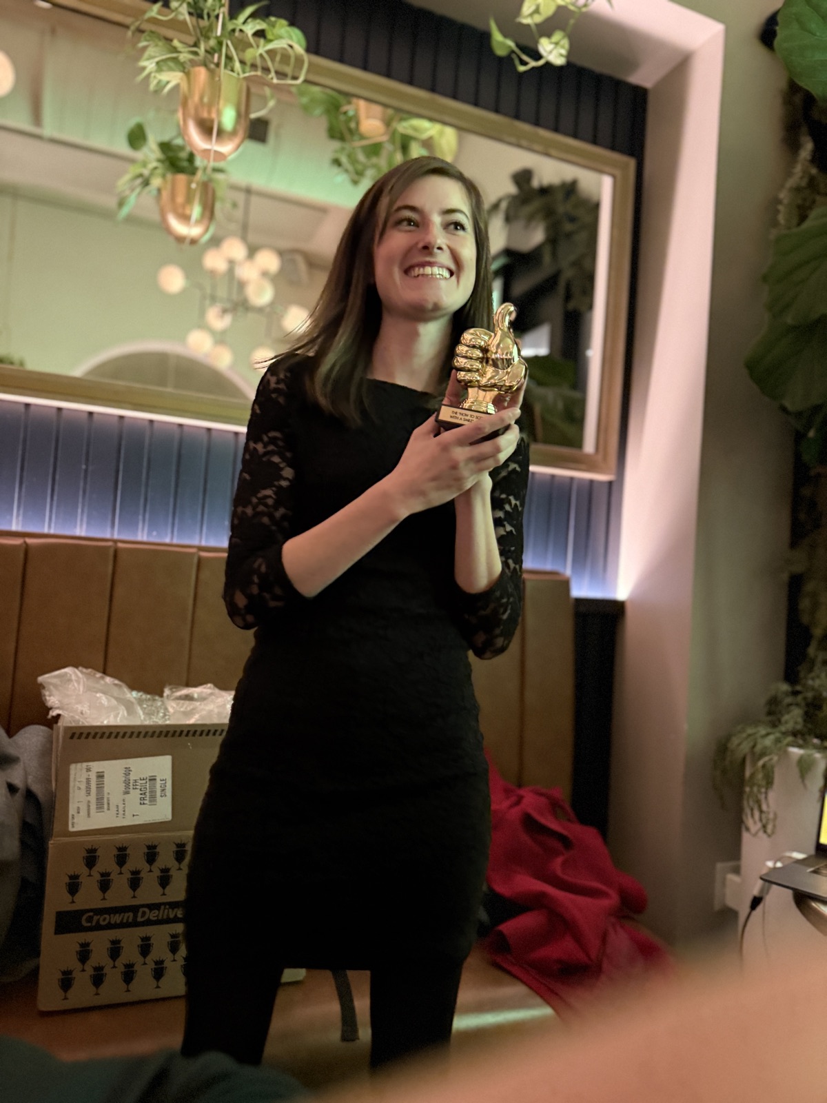 Morgen holding a Maycreate award