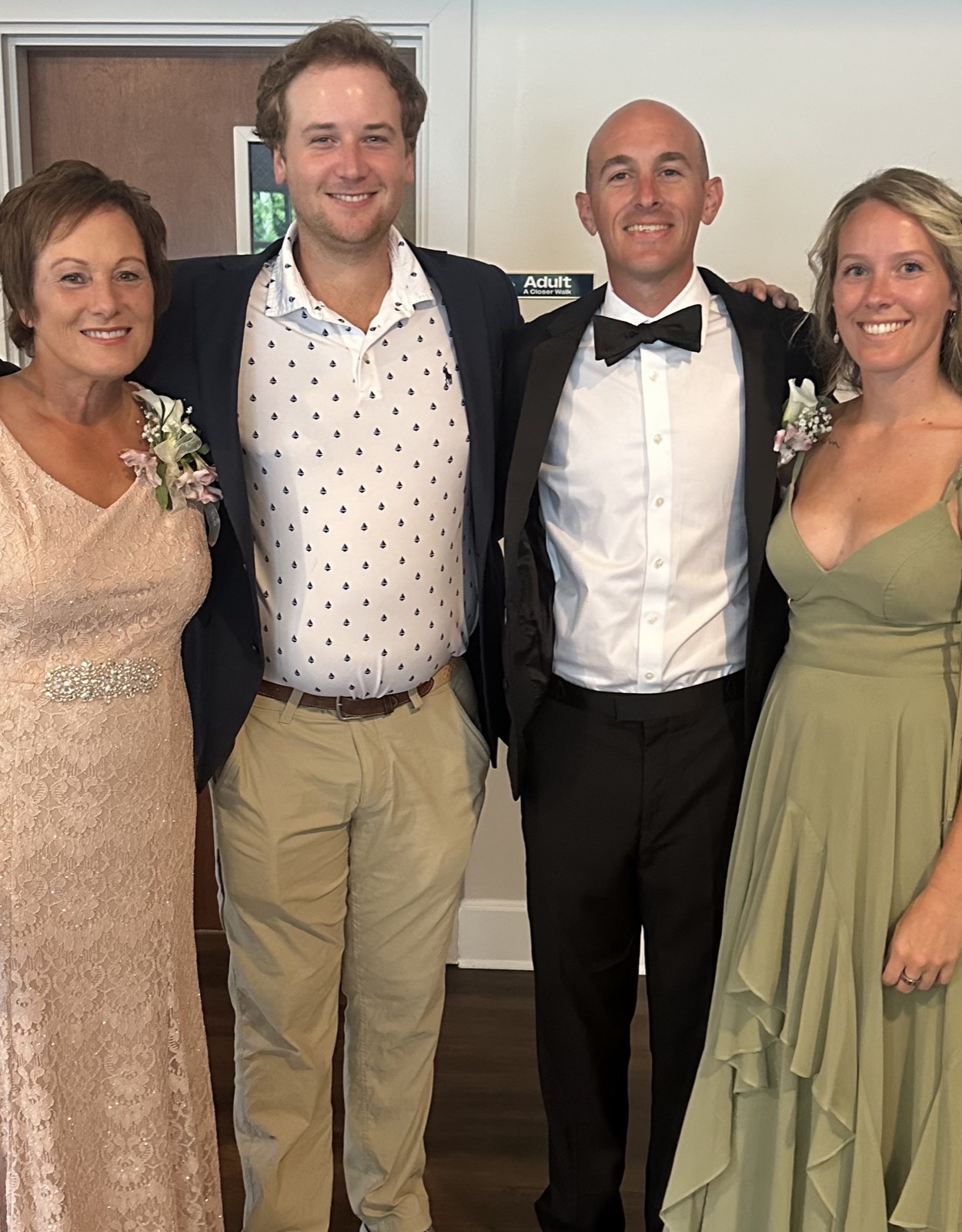 Suzanne with her family at a wedding