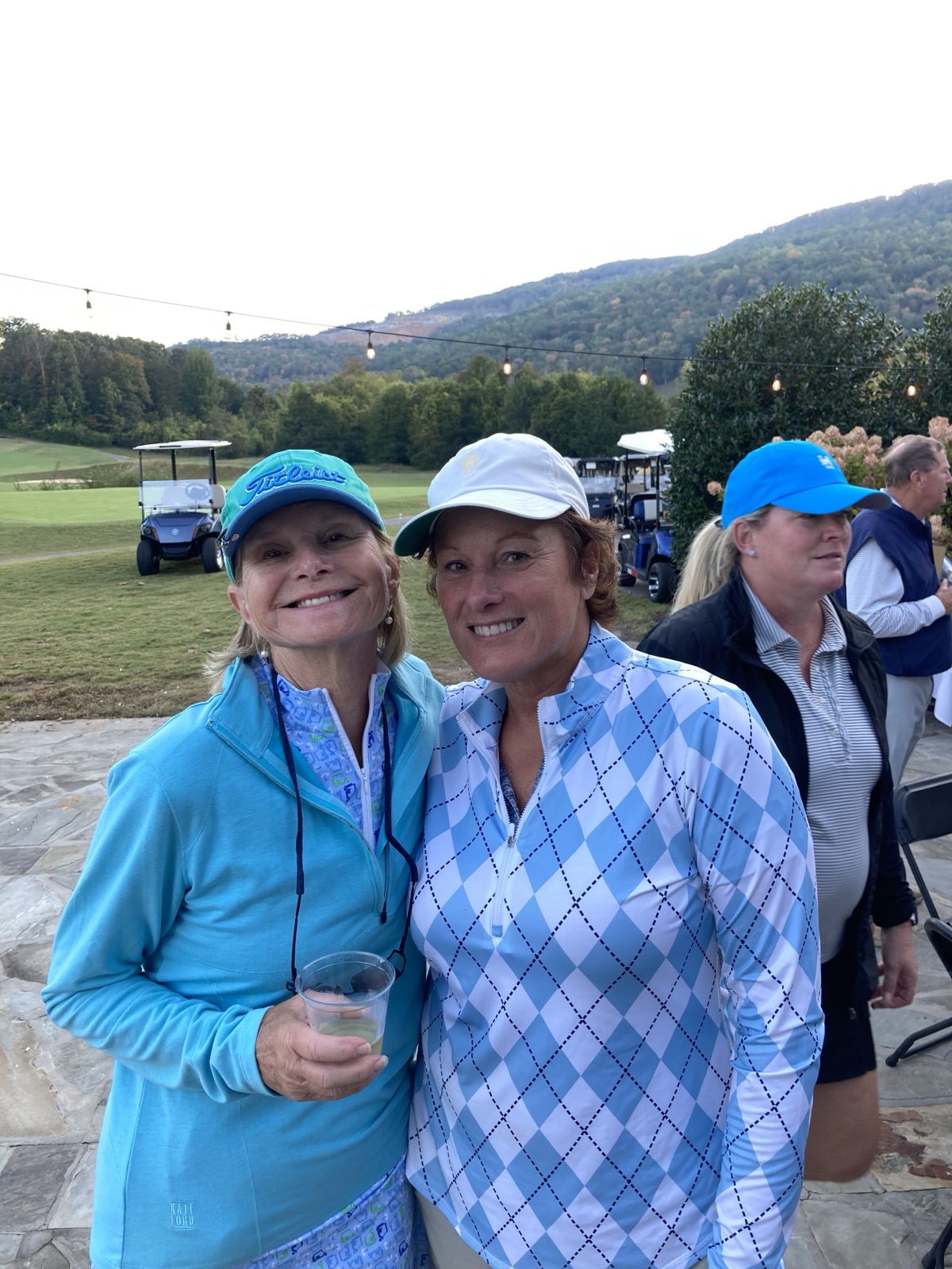Suzanne with a friend after a round of golf