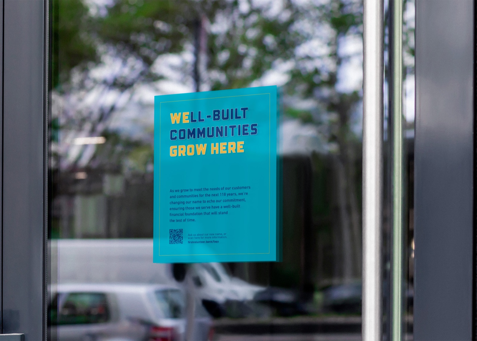 Window clings announcing the new name